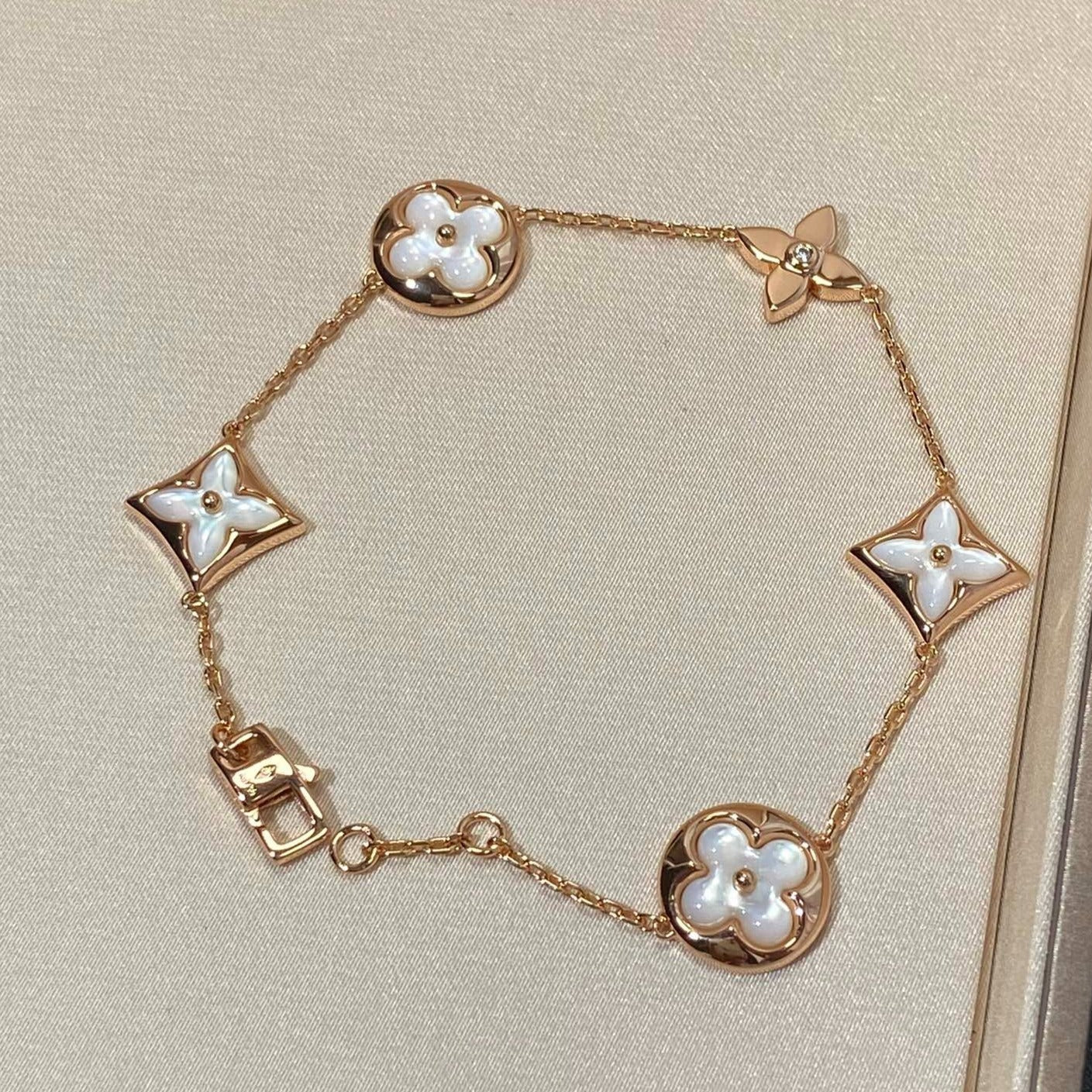 []STAR AND SUN 5 MOTIF MOP PINK GOLD BRACELET