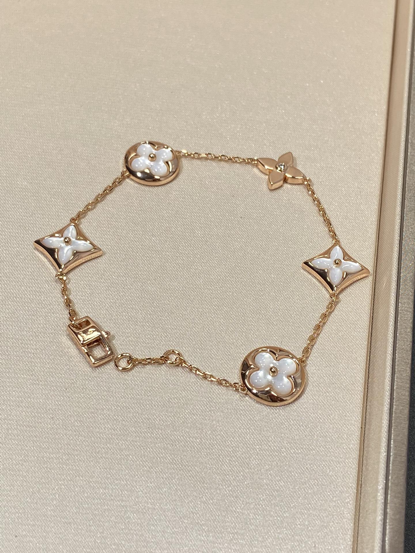 []STAR AND SUN 5 MOTIF MOP PINK GOLD BRACELET