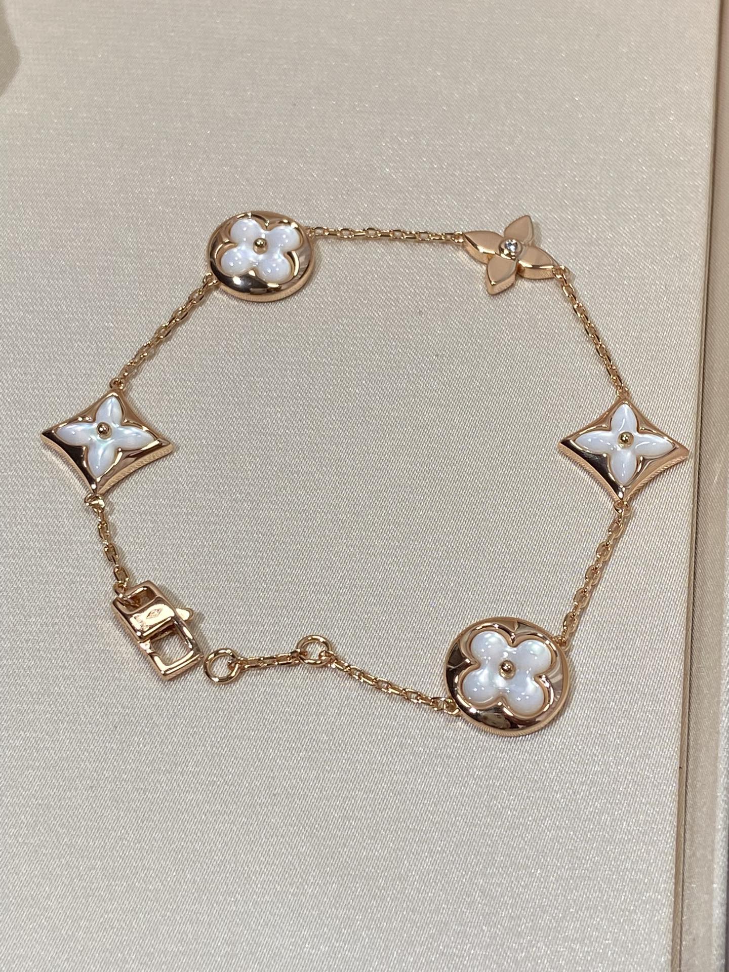 []STAR AND SUN 5 MOTIF MOP PINK GOLD BRACELET