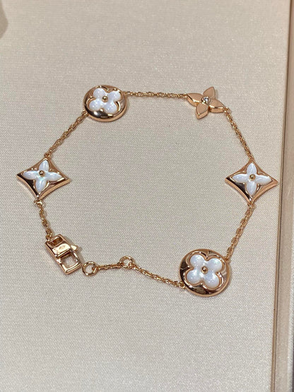 []STAR AND SUN 5 MOTIF MOP PINK GOLD BRACELET