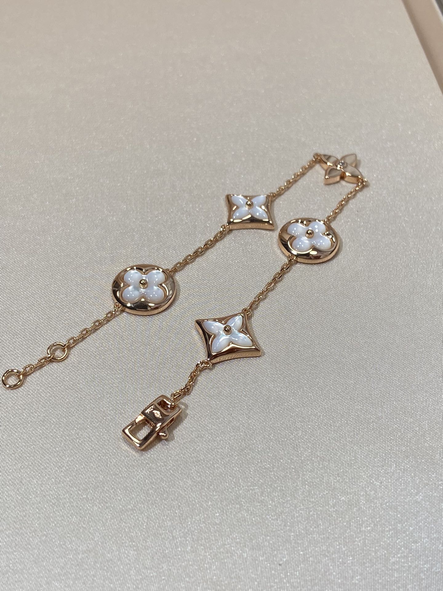 []STAR AND SUN 5 MOTIF MOP PINK GOLD BRACELET