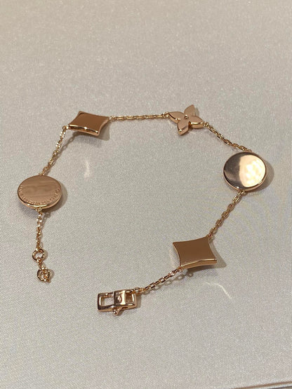 []STAR AND SUN 5 MOTIF MOP PINK GOLD BRACELET