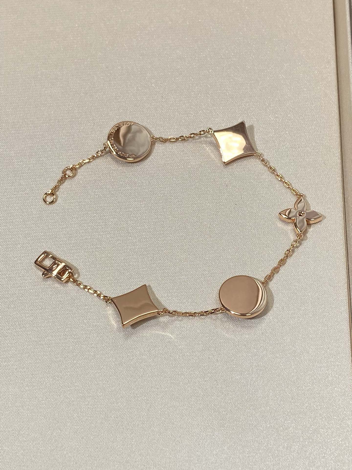 []STAR AND SUN 5 MOTIF MOP PINK GOLD BRACELET
