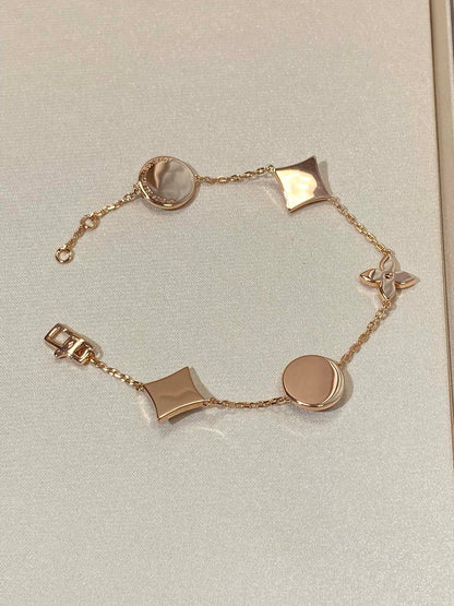 []STAR AND SUN 5 MOTIF MOP PINK GOLD BRACELET